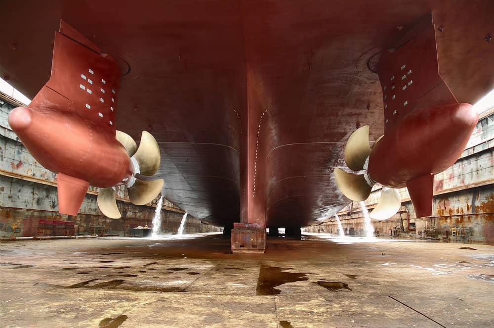 how much of a cruise ship is under water - view of the underside of a ship in dry dock