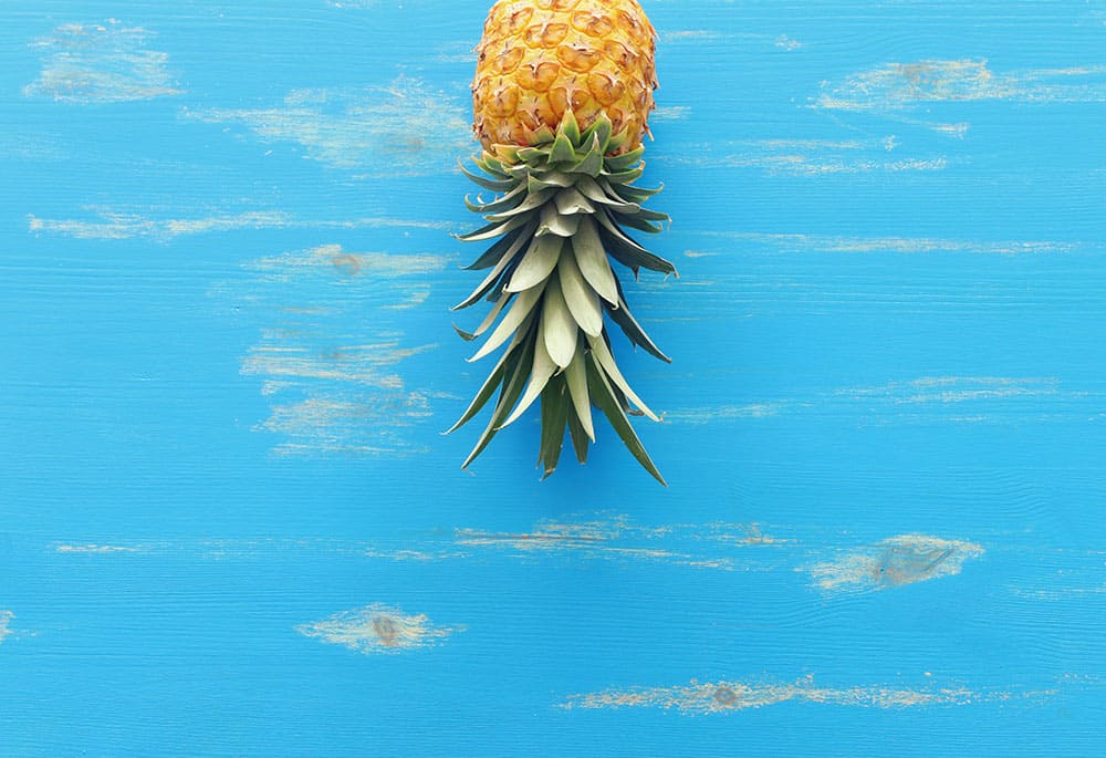 Upside Down Pineapple on Blue Background