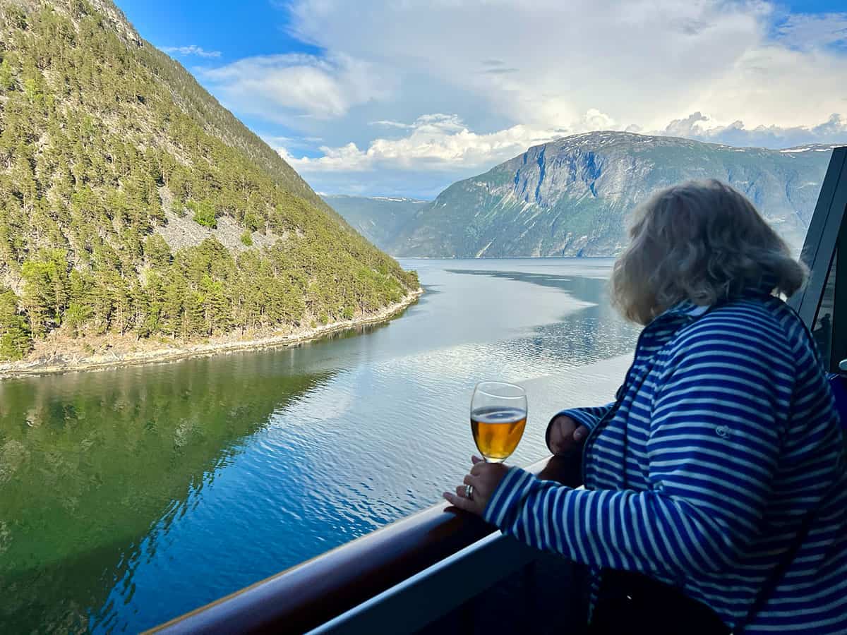 Morag looking out over the Norwegian Fjords from the deck of the Carnival Pride Cruise ship