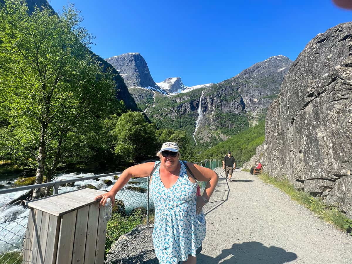 Morag posing at start of hiking climb to a glacier in Norway