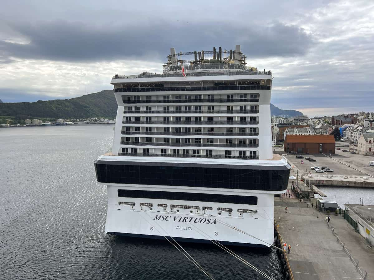 MSC Cruises Virtuosa ship docked at port in Norway.